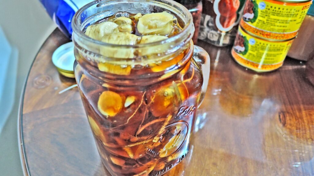 Layered fresh Korean red ginseng root slices in raw unpasteurized honey for intimacy energy