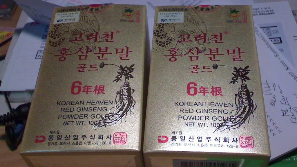 Pristine cured Korean red ginseng roots packaged in traditional wooden presentation box